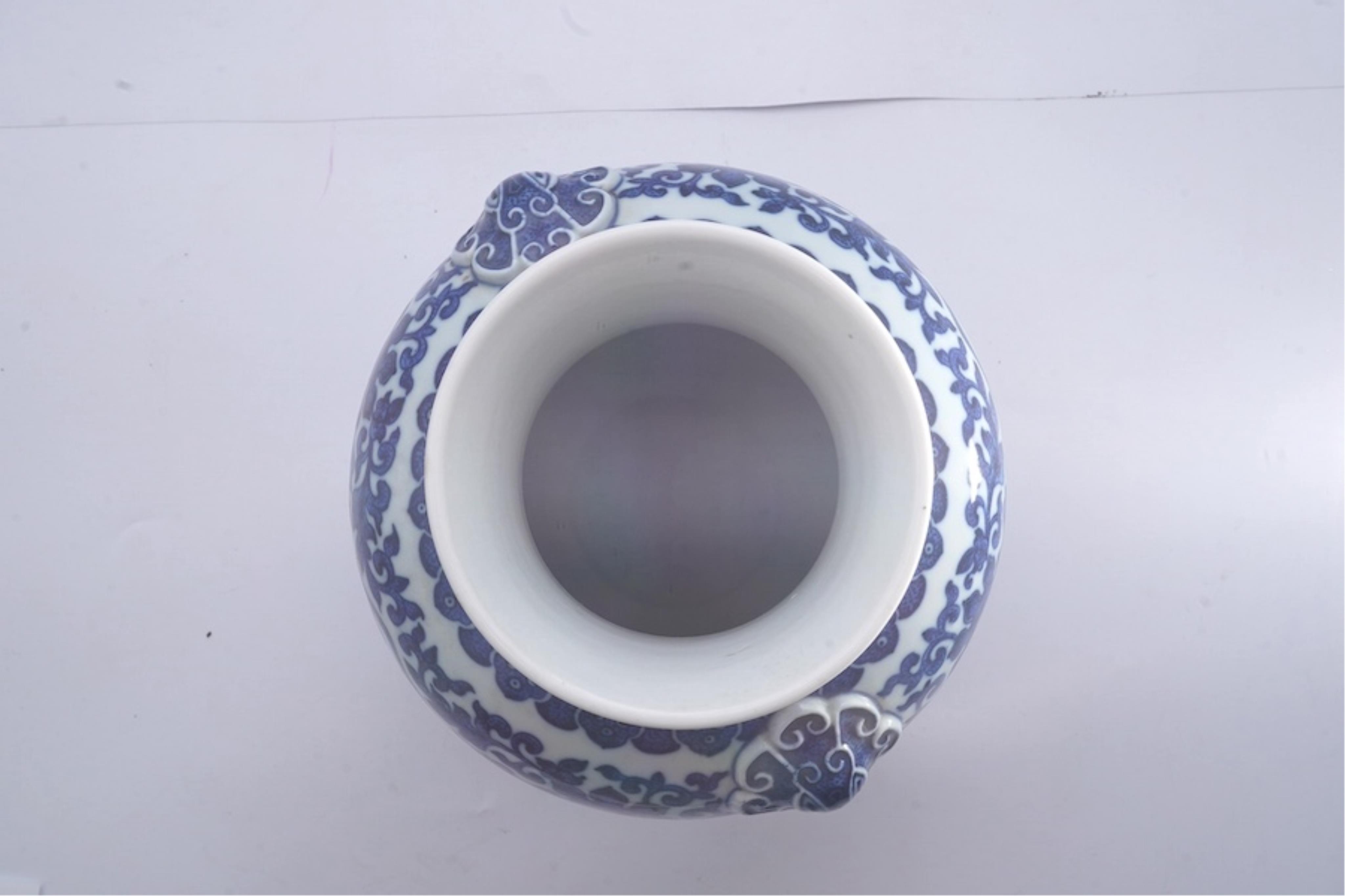 A Chinese blue and white 'peaches' vase, Qianlong mark but later, 27cm high. Condition - good